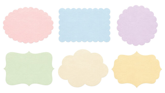 Six pastel scalloped paper label shapes in soft pink, blue, purple, green, cream and yellow arranged on a transparent background