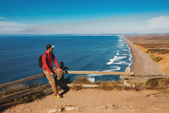 Travel in Point Reyes National Seashore, man Hiker with backpack enjoying view, California, USA