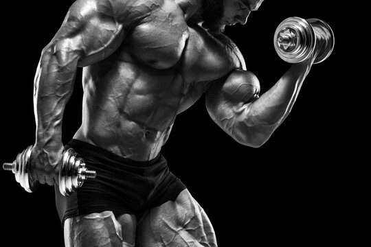 Muscular man doing exercises for biceps isolated. Bodybuilder male naked torso abs