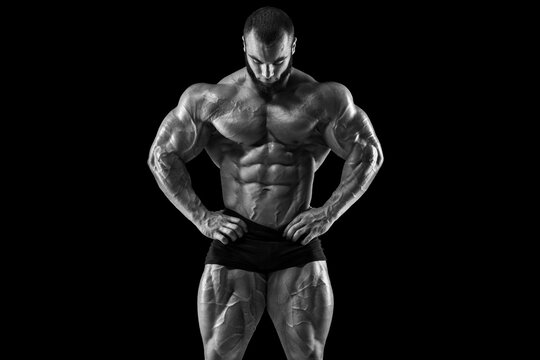 Muscular man showing muscles isolated. Bodybuilder male naked torso abs