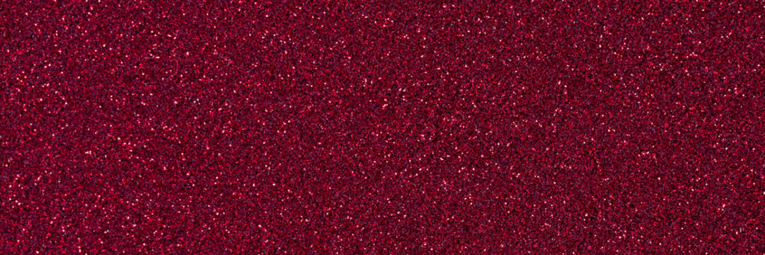Dark red glitter texture with sparkling crimson particles close up