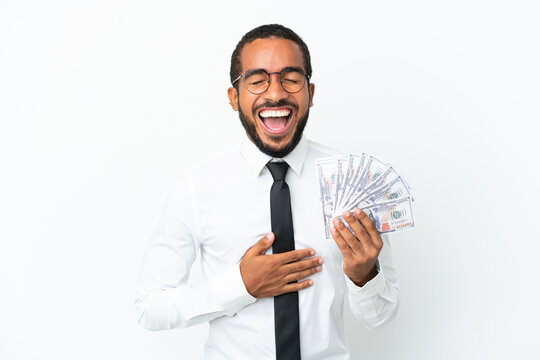 Young business latin man taking a lot of money isolated on white background smiling a lot
