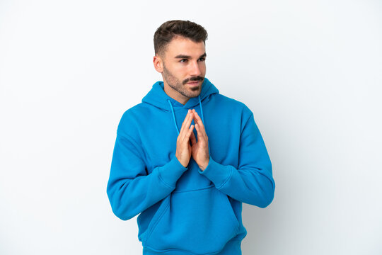Young caucasian man isolated on white background scheming something