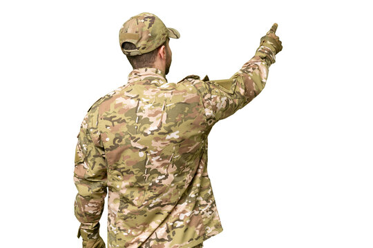 Military man over isolated chroma key background pointing back with the index finger