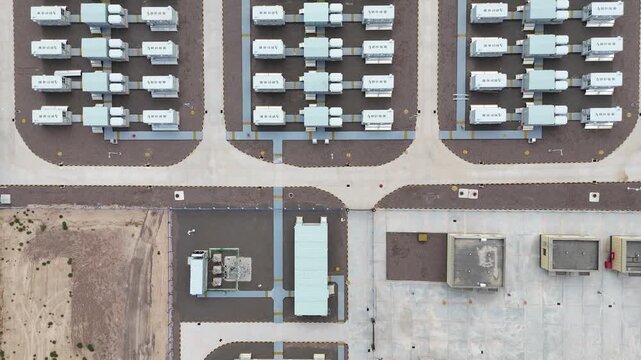 aerial view of neatly arranged shipping containers in logistics yard