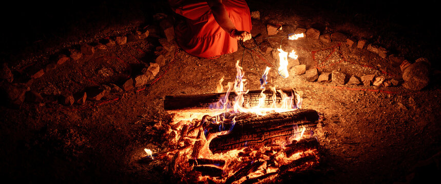 Close-up of Artist Lighting a Fire Stick at a Night Festival