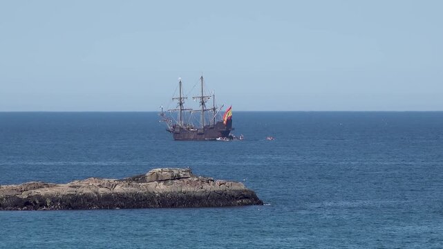 Historic Galleon with Spanish flag sailing close to the coast of Ireland in County Donegal