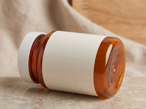 Amber pill bottle with blank white label for medicine supplement packaging transparent background