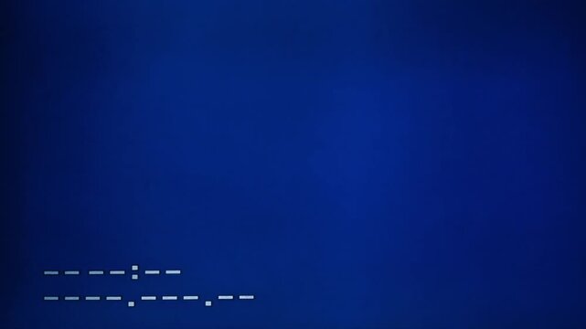 Blank blue MiniDV camcorder playback screen featuring minimal pixelated interface markings and digital tape indicators.