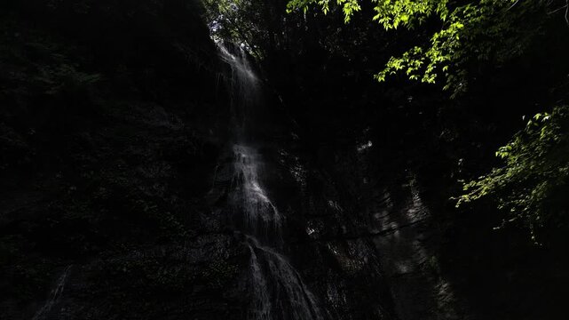 Sunlit Kanjou Falls in Mima, Tokushima, Japan &ndash; Aerial Drone View of a Waterfall Illuminated by Sunlight Filtering Through the Forest
