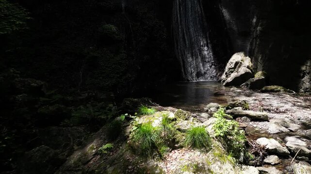Sunlit Kanjou Falls in Mima, Tokushima, Japan &ndash; Aerial Drone View of a Waterfall Illuminated by Sunlight Filtering Through the Forest
