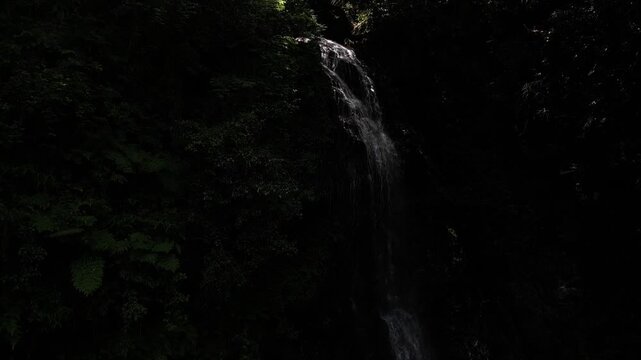 Sunlit Kanjou Falls in Mima, Tokushima, Japan &ndash; Aerial Drone View of a Waterfall Illuminated by Sunlight Filtering Through the Forest
