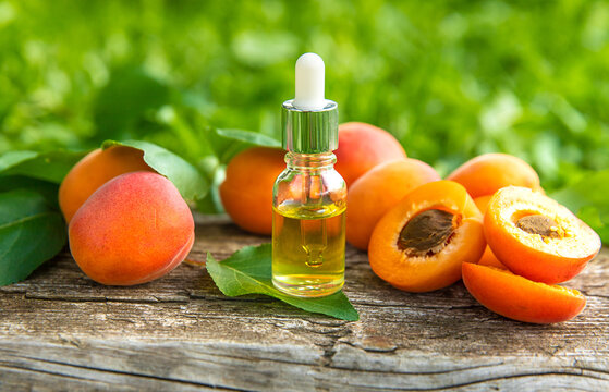 Apricot kernel oil in a bottle. Selective focus.