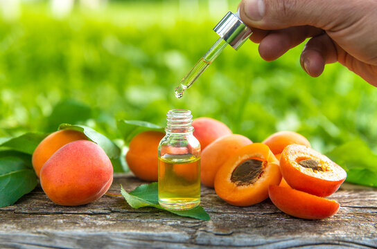 Apricot kernel oil in a bottle. Selective focus.