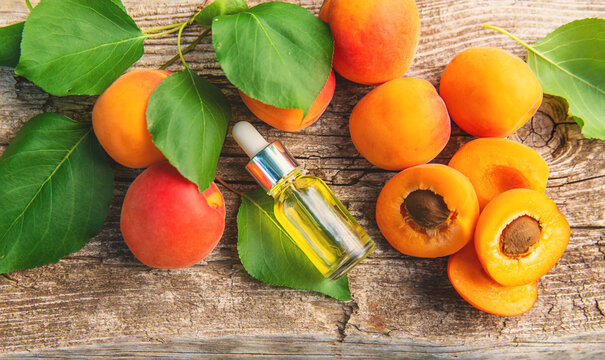 Apricot kernel oil in a bottle. Selective focus.