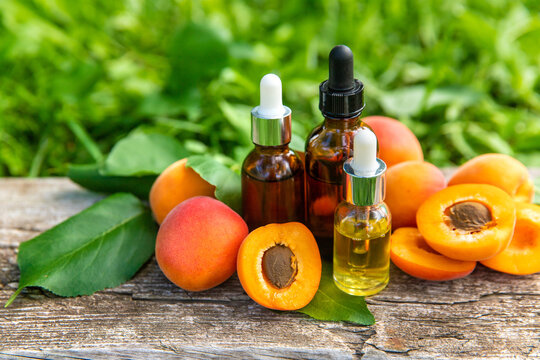 Apricot kernel oil in a bottle. Selective focus.