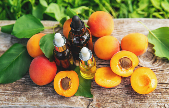 Apricot kernel oil in a bottle. Selective focus.