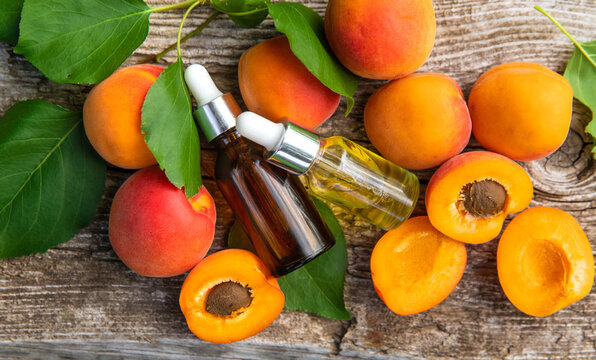 Apricot kernel oil in a bottle. Selective focus.