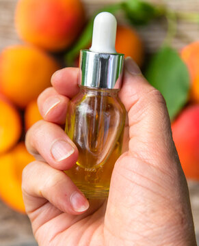 Apricot kernel oil in a bottle. Selective focus.