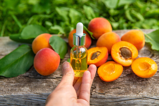 Apricot kernel oil in a bottle. Selective focus.