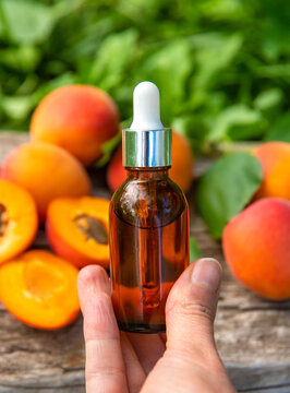 Apricot kernel oil in a bottle. Selective focus.