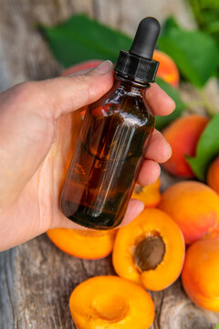 Apricot kernel oil in a bottle. Selective focus.