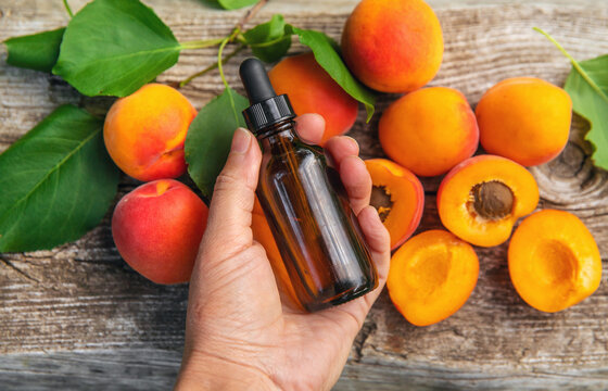 Apricot kernel oil in a bottle. Selective focus.