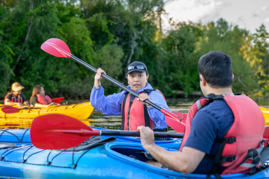 Kayaker practicing paddle strokes during an evening group paddle on the Toronto Islands
