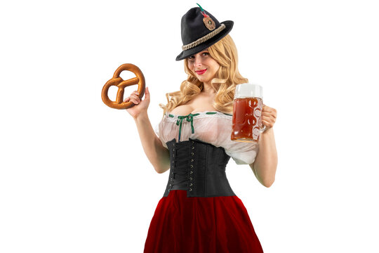 Oktoberfest girl waitress holding pretzel. Woman in dirndl, tyrolean hat serving beer mug. Isolated background. Traditional Bavarian, German, Austrian party, autumn festival