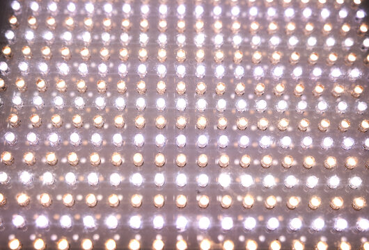 Extreme close-up of a bright LED spotlight panel for photo and video shoots. Technology, illumination, electricity, Light equipment for movie production, photo shooting.