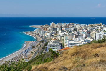 Fototapeta premium Aerial cityscape view of Rhodes town, city beach resort and turquoise coastline with hotels and Aegean Sea beach in Greece