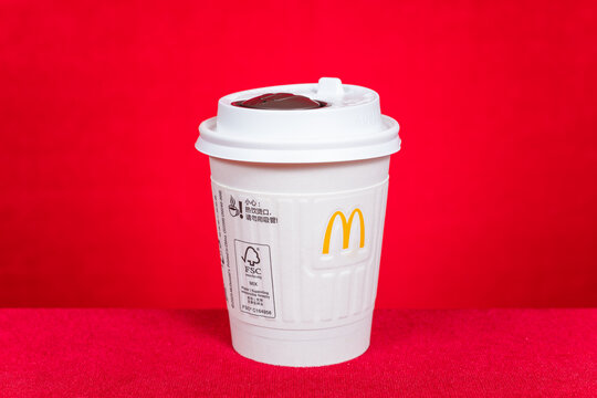 ZHONGSHAN China-June 21 2026: McDonalds white disposable paper hot beverage cup with plastic lid.