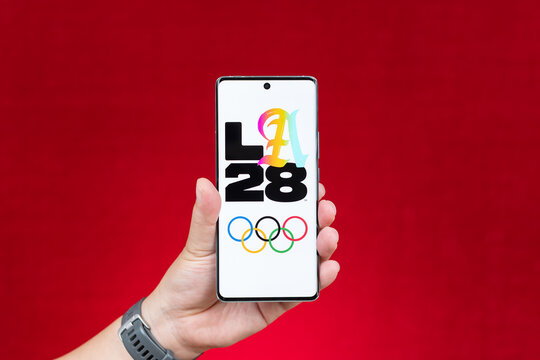 ZhongShan GuangDong China-May 22 2026: Hand holding smartphone showing LA28 Los Angeles Olympic logo.