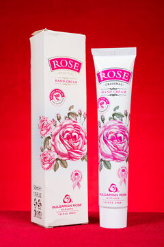 ZhongShan GuangDong China-October 18 2025: Bulgarian Rose Karlovo rose hand cream tube and matching product box against solid red background.