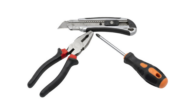 Professional hand tools set on white background. Industrial pliers, screwdriver and utility knife. Construction equipment for home repair and maintenance.