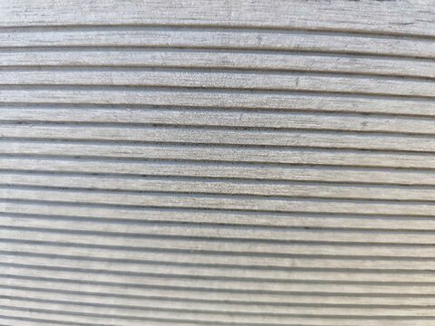 Grooved gray composite decking texture background
