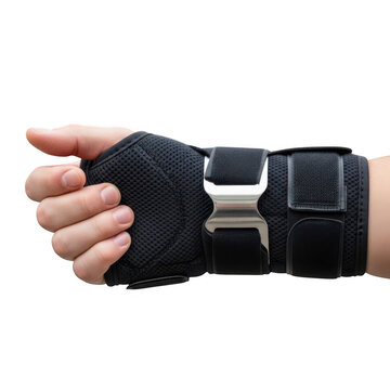 A close up view of a human hand wearing a black medical wrist brace with adjustable straps isolated against a clean white background