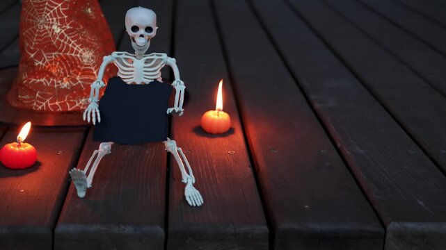 Evening Halloween Terrace Scene with Pumpkins and Skeleton - Real Home Decor