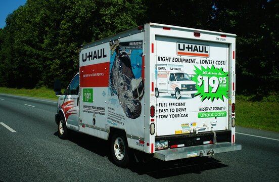 Cecil County, Maryland, U.S.A - Aug 29, 2026 - A U-Haul moving truck advertising rental pricing and features drives along Interstate 95.