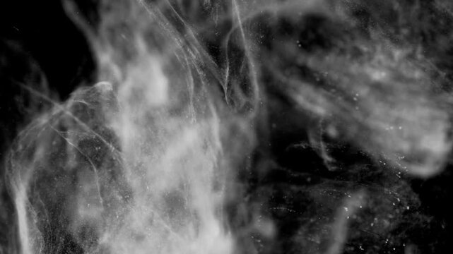 Abstract White Ink and Fine Particle Cloud Dissolving in Water
