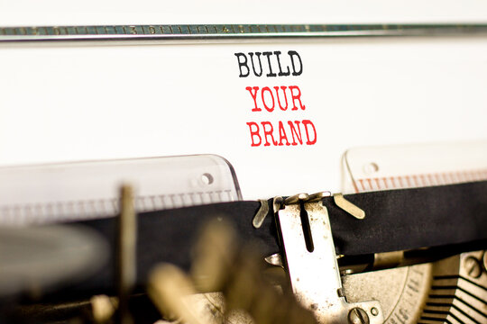 Build your brand words symbol. Concept words Build your brand typed on beautiful old retro typewriter. Beautiful white background. Business and build your brand concept. Copy space.