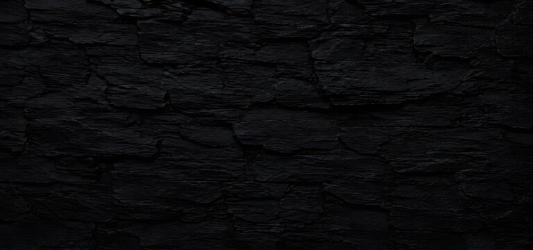 High-resolution black slate stone wall texture with layered, rugged rock surface, natural mineral grain, dark charcoal tones, and organic cliff detail.