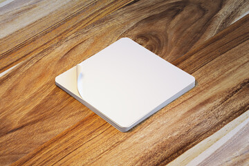 Fototapeta premium Blank square sticker sheet mockup on warm wooden tabletop, clean modern branding template with generous copy space for advertising design. 3D Rendering