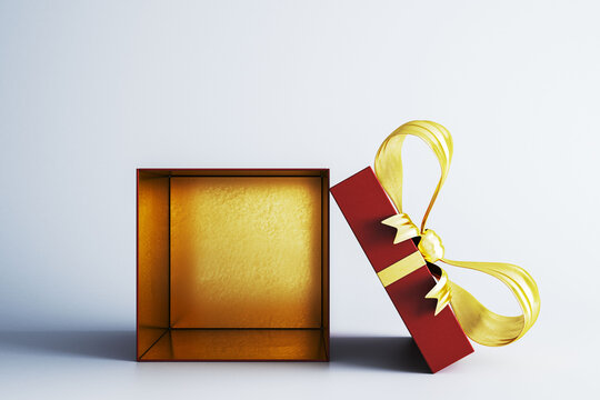 Open red gift box with golden ribbon, blank packaging mockup and generous copy space for modern branding design promotion. 3D Rendering