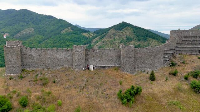 Ruins of medieval fortress Maglic on top of hill by the Ibar river in Serbia. On the wall of medieval fortress Maglic