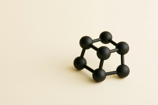 Benzene ring molecule model of black spheres science concept