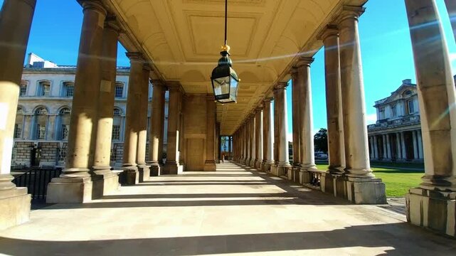 Historic colonnade with classical architecture and sunny sky