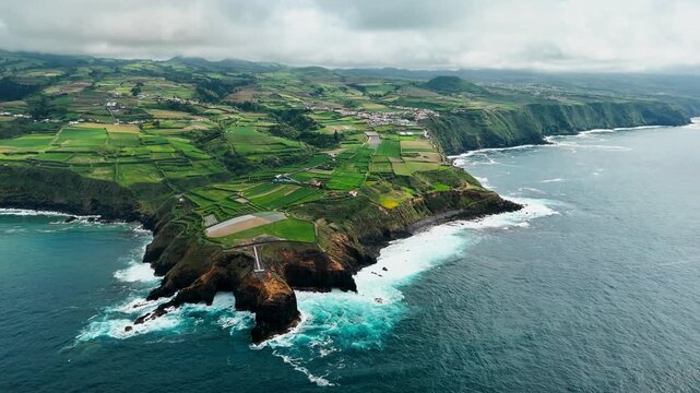 Rural settlement and coastal agriculture in the Azores, aerial view of farmland along steep Atlantic cliffs on Sao Miguel Island