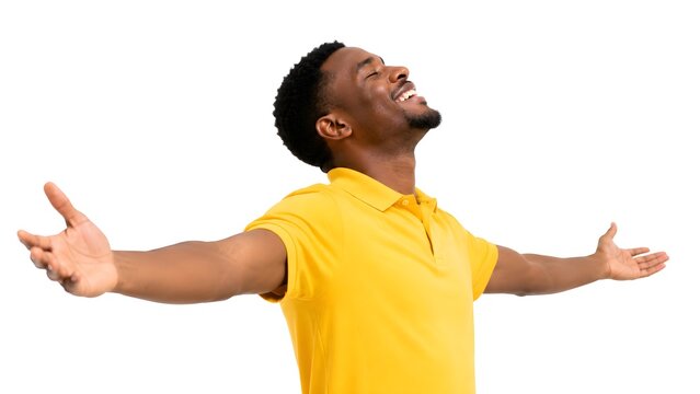 A joyful young man with outstretched arms, eyes closed in bliss, radiating pure happiness and freedom. He celebrates success and a positive life outlook on white