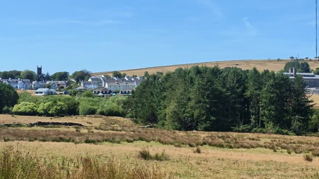 Princetown Dartmoor Devon England UK. 11.08.2026. Video.  View across farmland to Princetown and Dartmoor Prison in Devon UK.
